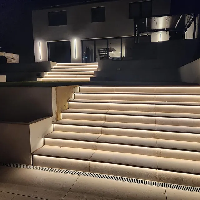 New build property and garden steps and patio with lights Hertfordshire